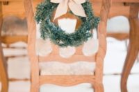 14 small fir wreath with beige ribbon looks awesome in vintage wooden chairs