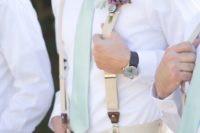 16 neutral groom’s look with a mint tie and a lavender boutonniere