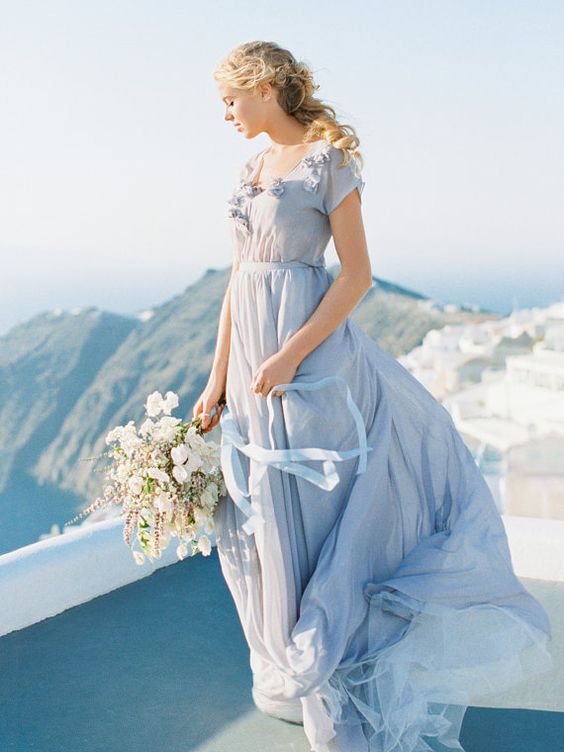gentle blue flowy wedding gown with floral appliques