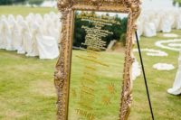 17 rustic mirror wedding seating chart in an antique frame