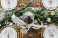 18 table runner made of fresh, seasonal greenery is a chic way to decorate tables at your winter reception