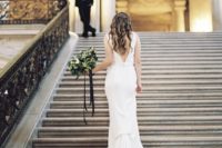 19 modern wedding dress with a train and a statement back