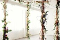 19 rustic twig wedding arbor decorated with flowers and greenery