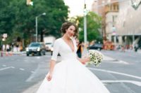 20 midi wedding gown with a plunging neckline and heels