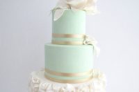 20 mint cake with gold and ivory ruffles and flowers