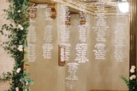 20 oversized seating chart decorated with candles and fresh flowers