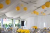 20 patterned grey and white tablecloths, yellow table runners and flowers
