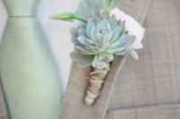 21 light grey groom’s suit, a mint tie and a succulent boutonniere