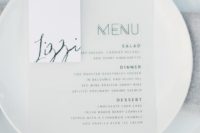 21 simple modern place setting with a printed menu and neutral dishes