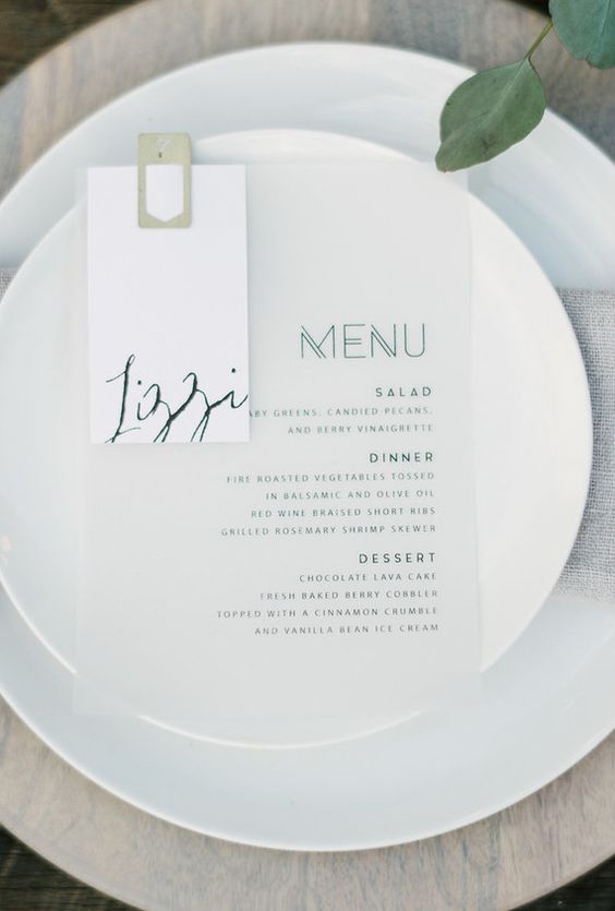 simple modern place setting with a printed menu and neutral dishes