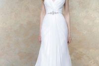 22 draped wedding dress with embellished straps and a thin beaded belt