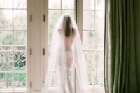 23 boudoir-styled picture with lingerie, shoes and a veil