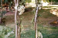 23 wooden wedding arch decorated with white flowers