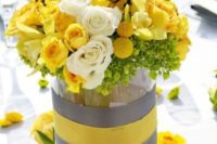 23 yellow and grey centerpiece with lush flowers