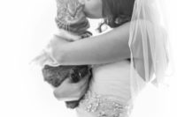 24 bride kissing her cat