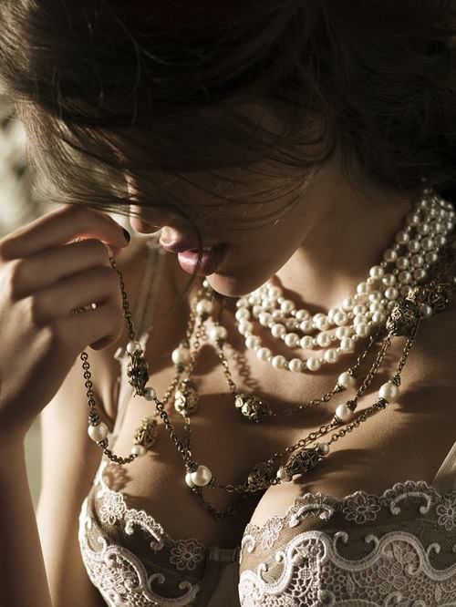 wear statement necklaces and pearls for a chic look