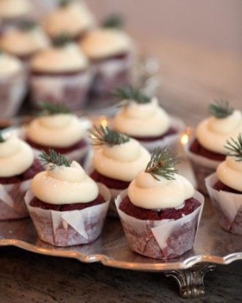 small evergreen pieces as cupcake toppers for a winter wedding