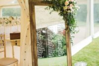 26 mirror seating plan in a rustic frame with foliage