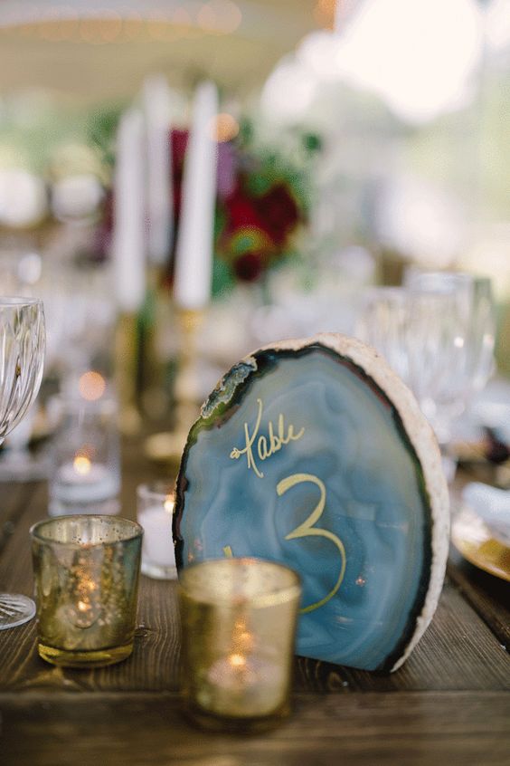 geodes are hot in wedding decor, and you can write table numbers with gold on them