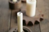 27 old gears as industrial candle holders