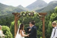 28 rustic wooden arch decorated with moody florals