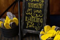 30 grey and yellow flip flops for guests to dance