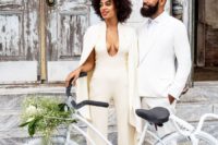 30 ivory pantsuit with a cape was worn by Solange Knowles