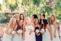 30 mint bridesmaids’ dresses and a maid of honor in navy
