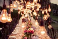 30 steampunk wedding table with industrial bulb decor over it