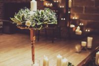 31 decorate your venue with cool fresh wreaths with a candle inside
