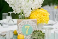 31 mint fabric and table number on a doily, yellow lemonds and flowers