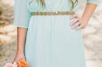 31 mint short bridesmaid’s dress with an embellished gold sash