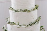 31 three-tier wedding cake decorated with greenery
