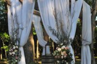 31 wedding pergola with white curtains and lush florals