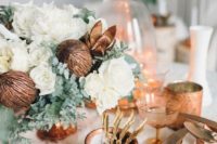 31 winter table setting with a fur tablecloth and copper and white touches