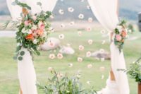 32 wood wedding arch with white curtains, flowers and hanging flower heads