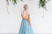 33 bridal two piece wedding gown with a blue skirt and a train and a lace top