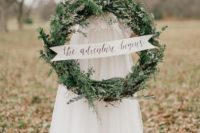 33 fir winter wedding wreath with a sign