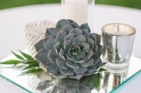 33 vintage mirror wedding centerpiece idea with candle holders and a succulent