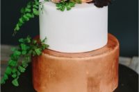 35 copper and white wedding cake topped with greenery and flowers