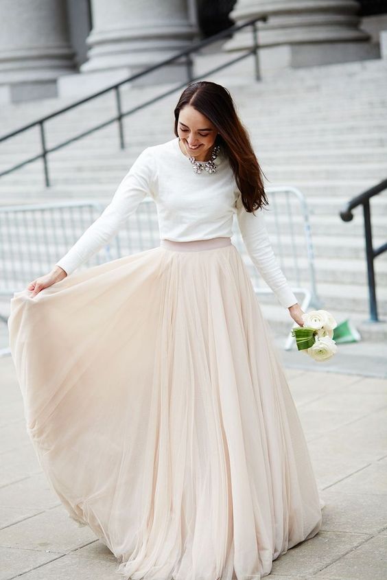 bridal separate with a blush maxi skirt and a white sweater, a statement necklace