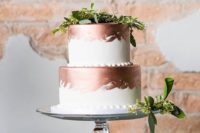 36 copper and white wedding cake topped with greenery