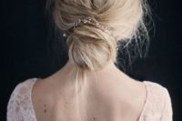 36 delicate wedding hairstyle with a bun and a crystal hairpiece