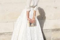 37 bridal separate with a lace midi skirt and a neutral sweater, a whimsy clutch and heels