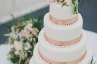 39 five-tiered wedding cake with copper ribbon and fresh flowers