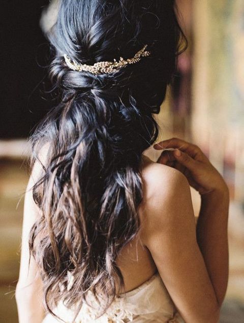 half down hair with a crystal hairpiece to accentuate it is definitely a steal-worthy hairstyle