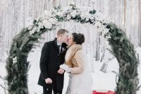 a lovely round wedding arch for a winter wedding
