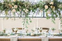 air plants, greenery and roses chandliers over the reception