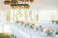 super bold flower chandeliers are amazing for a fall wedding reception, make several of them