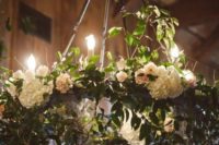white hydrangea and greenery chandelier with bulbs